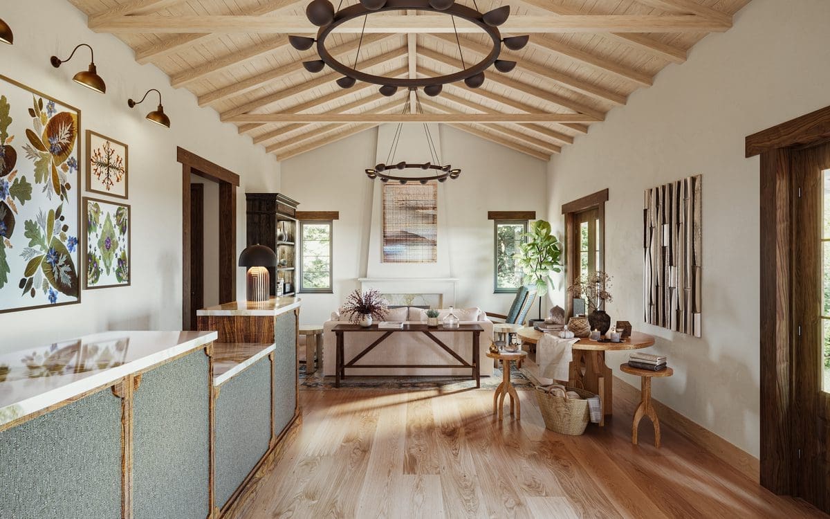 A bright living room with wooden floors, exposed beam ceiling, modern rustic furniture, wall art, plants, and large windows letting in natural light.